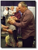 Gil praying for a young girl for healing and change. 
